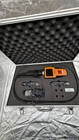 Kit in open aluminum case showing borescope, probe, attachments