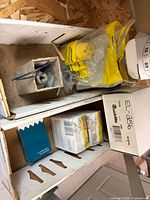 Boxed lot showing Woodhead plug in bag, small solenoid box, radiator cap boxes and flasher box