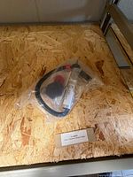 Factory-sealed bag containing the throttle assembly and accessories on shelf