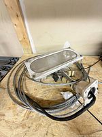 Fixture with cables, bracket, wiring visible