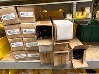 Stacked sealed boxes labeled P/N 1050 containing Adjustamount kits