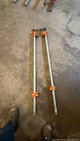 Pair of Pony pipe clamps full length view