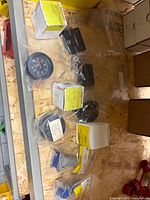 Overview of boxed and bagged gauges, switch, locks and hardware on shelf