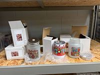Five boxed mason jar mugs, three shown with lids and prints visible