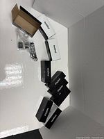 Multiple Southco boxes displayed with one chrome latch and hardware visible