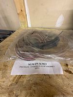 Bagged pump assembly, tubing and wiring harness with printed part identification sheet