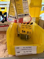 Two packaged Techspan battery jumper terminals in yellow bin