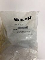 Front of sealed Whelen package showing logo, model and part number
