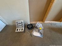 Overall lot showing siren speaker, control box, seatbelt assembly in bag