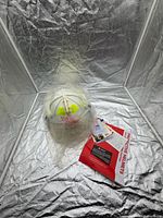 Helmet with visor, tags, safety leaflet overall view