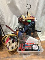 Belts, display rack, basket and plastic bin with shoe care items visible