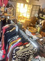 Overview of chrome clothing rack with garments (not included)