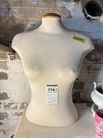 Fabric-covered mannequin torso front view