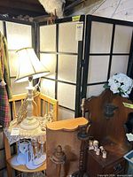 Room divider and owl in situ showing panels and owl perched on top