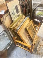 Rack holding framed art viewed from side