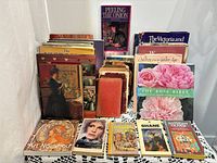 Overall lot of books on lace-covered surface, front and rear rows visible