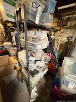 Front view of black metal shelving unit with four shelves