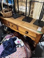 Full view of pine console table with items on top