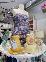 Pitcher, basin and additional items on display table