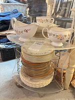 Overall view showing stacks of plates, creamer and gravy boat