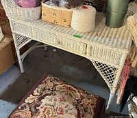 Front and side view of white wicker console desk showing overall design and condition
