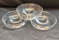 Three clear glass bowls showing overall lot