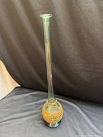 Full view of tall green glass bud vase