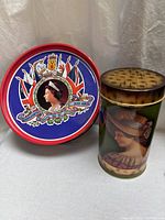 Both tins side by side