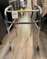 Full view of Airgo folding walker standing on floor