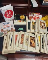 Group shot of all cookbooks and spiral booklets on desk