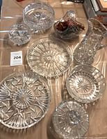 Group shot of all seven crystal pieces on table