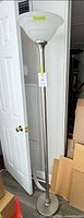 Full view of 72-inch brushed nickel torchiere floor lamp with frosted glass shade