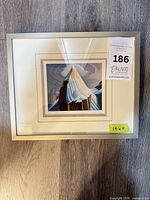 front view of framed mountain art print showing image, matting and frame