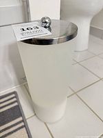 Full view of canister showing frosted body and lid