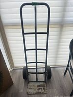 Front view of steel hand trolley showing full frame and wheels