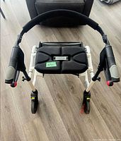Top view of Nexus rollator showing padded seat and handle grips
