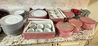 Dinnerware set in storage organizers on countertop