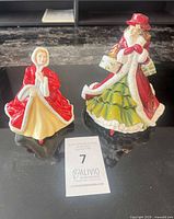 Both Royal Doulton figurines front view beside lot card