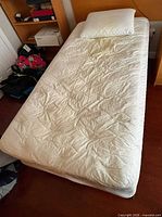 Top view of mattress on box spring and frame