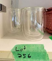 Side view of two double-wall tumblers on shelf