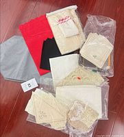 All table linens spread on floor showing variety