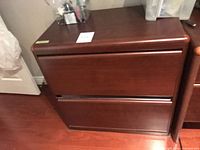 Front view of dark brown two-drawer lateral filing cabinet