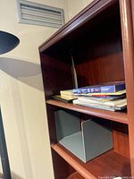 Upper portion showing adjustable shelves and wood finish