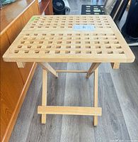 Top view of IKEA wooden folding table showing lattice design