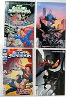 All four Batman/Superman comics laid out together