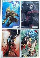 Front view of four variant comic covers bagged and boarded