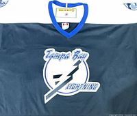 Front view showing Tampa Bay Lightning logo on jersey
