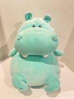 Front view of mint plush hippo