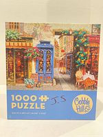 Front of Cobble Hill 1000-piece puzzle box showing artwork