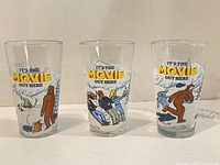 Three Kokanee 16 oz pint glasses showing front graphics